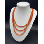 A Victorian coral bead three strand necklace with original clasp