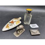 An enamel and silver top scent bottle, a porcelain Urn shaped scent bottle, a stamp envelope and a