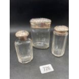Three silver top jars with glass bodies, Birmingham 1906 etc