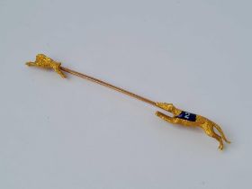 A EDWARDIAN STICK PIN DEPICTING GRAY HOUND COURSING 15CT GOLD AND 9CT BOXED 4.6 GMS
