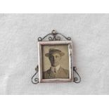 A miniature photo frame with pierced scroll mount, 1.5" high, Birmingham 1903 by CM?