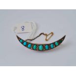A Victorian crescent shaped brooch with turquoise and diamonds 4.6 gms