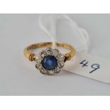 A sapphire and diamond cluster ring 18ct gold size N