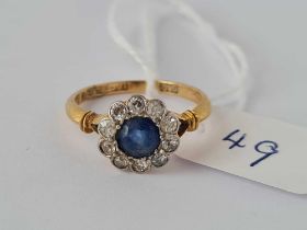 A sapphire and diamond cluster ring 18ct gold size N