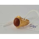 A brown stone ring mounted in 18ct gold size J 4.7g inc