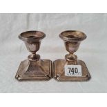 A pair of candlesticks with octagonal bases, 3" high, Chester 1911