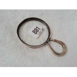 A magnifying class with horseshoe shaped handle, 4.5" wide, Birmingham 1913