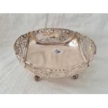 A fruit bowl with pierced sides, four scroll feet, 8.5" wide, London 1970's, 940g