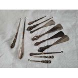 11 Silver Handle shoe horns, button hooks etc…