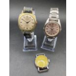 A SEIKO automatic wrist watch with seconds sweep and date aperture and another by RUHLA and one by