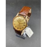 A GENTS TUDOR GOLD WRIST WATCH WITH SECONDS SWEEP 9CT W/O