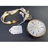 A silver pocket watch with key with second dial