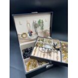 A fitted jewellery box of old costume jewellery