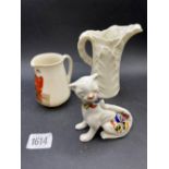 A royal Worcester white jug a goss jug and another