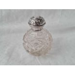 Scent bottle with embossed cover, cut glass body, Birmingham 1908