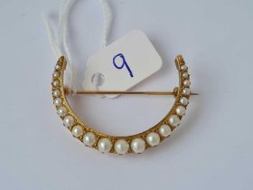 A Victorian pearl set crescent brooch 15ct gold 5.8 gms