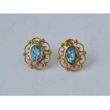 A pair of blue stone earrings 9ct