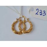 A pair of bamboo design hoop earrings 9ct