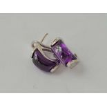A pair of mauve stone 14k white gold earrings with safety backs 9.6g inc