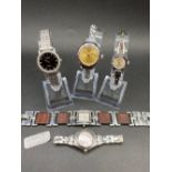Five ladies wrist watches including one by FOSSIL SWATCH and three others