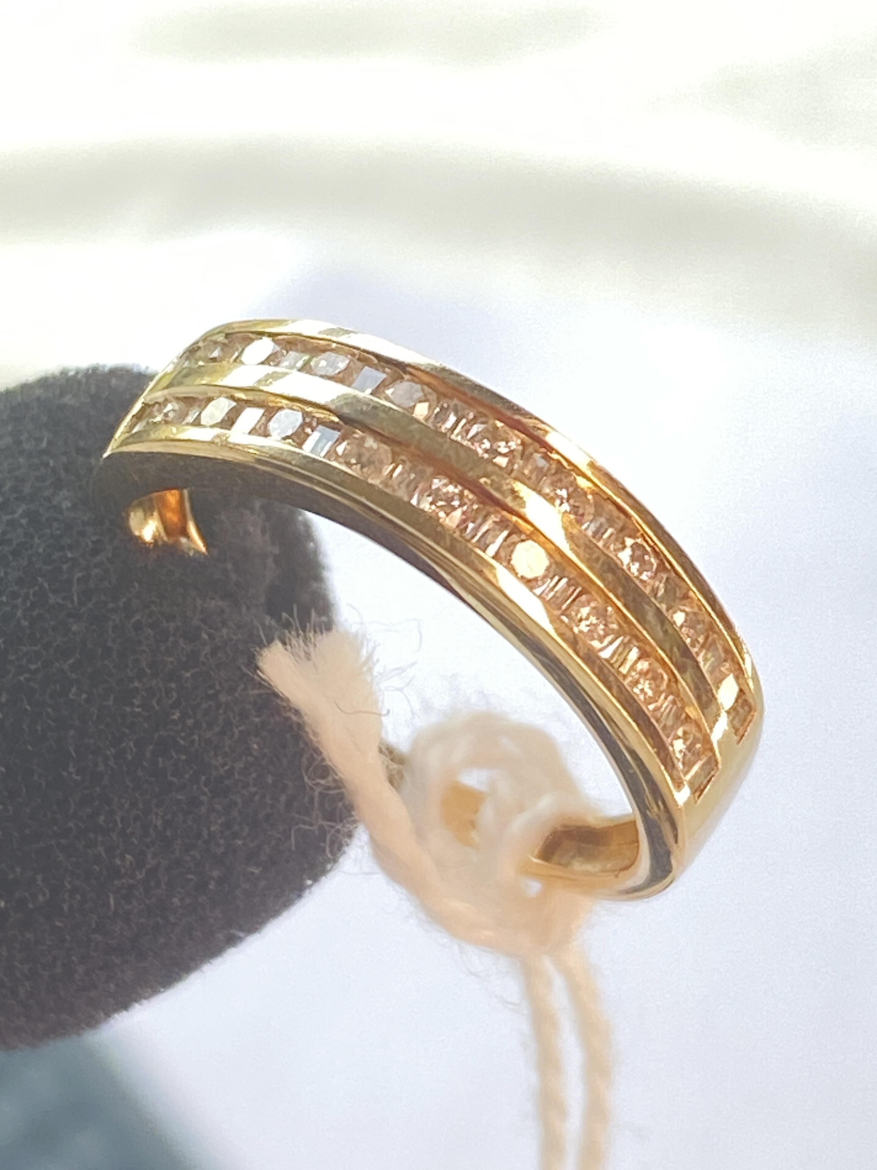 A double row half eternity ring set alternating square and round diamonds