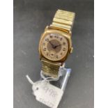 A 9ct gold wrist watch with flex strap seconds dial