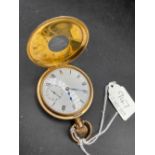 A gents gilt half hunter pocket watch with seconds dial W/O