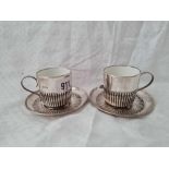 A pair of cups and saucers with fluted decoration, London 1894 (porcelain bodies)