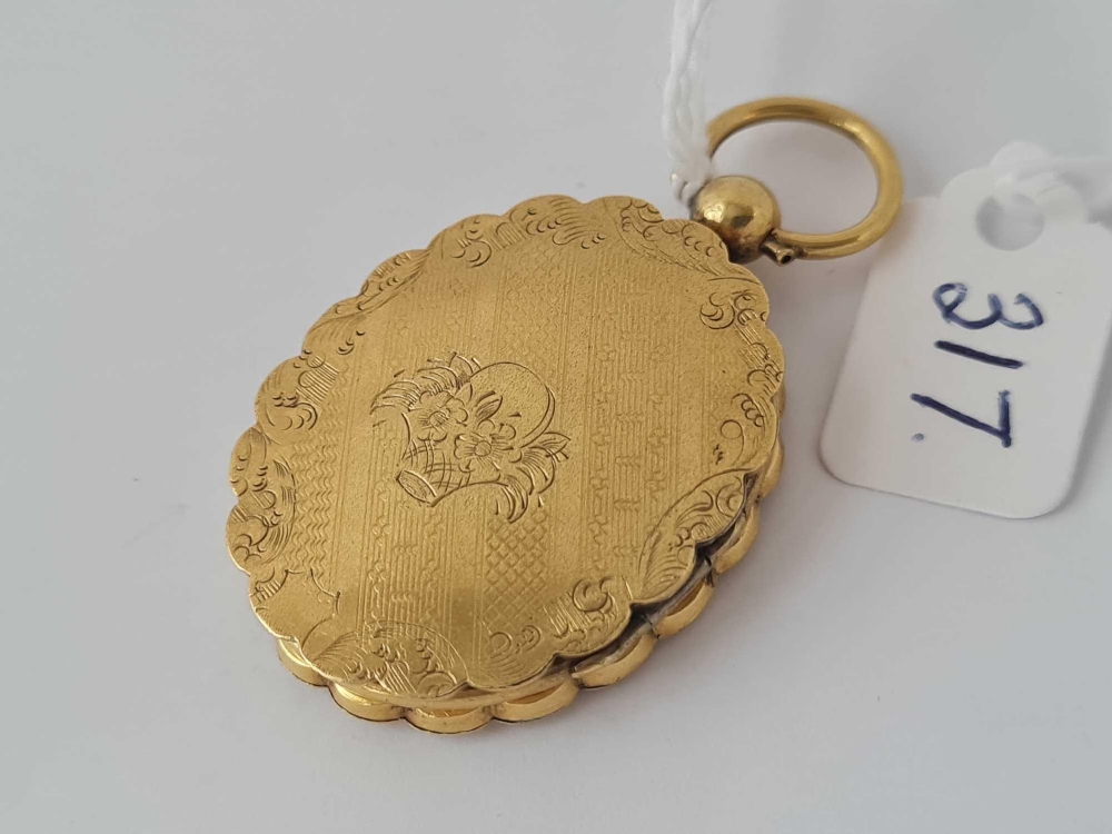 A mid Victorian double opening yellow metal locket with original portrait inside - Image 2 of 4