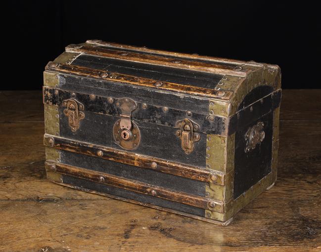 A 19th Century Domed Topped Casket in the form of a miniature travelling trunk.