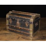 A 19th Century Domed Topped Casket in the form of a miniature travelling trunk.