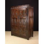 A Large 19th Century Panelled Oak Floor Standing Cupboard in the 17th century style.