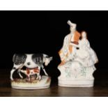Two Staffordshire Pottery Figure Groups: A Victorian flat-back group of a highlander playing pipes