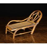 An Early 20th Century Miniature Bamboo Chaise Longue with a domed lattice-work back rest and