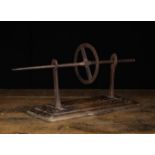 An 18th Century Wrought Iron Hand Spit mounted on a rectangular treen base with stepped border
