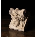 A Charming Antique Style Corbel relief cast with a cherub's head crowned in foliate scrolls beneath