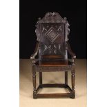 A Charles II Oak Wainscot Chair.
