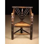 A 17th Century Elm Turner's Chair composed of decoratively turned spindles with three upright posts