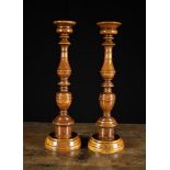 A Similar Pair of Fine 19th Century Turned Walnut Altar Sticks of rich colour and patination.