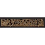 A 17th Century Pierced Pediment Rail carved both sides with undulating scrolls of foliage bearing