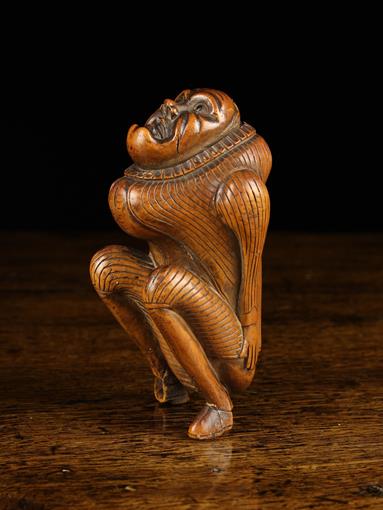 An 18th Century Carved Boxwood Scatological Snuff Box with dispenser.