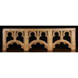 A 16th Century Painted Oak Canopy Rail carved with a row of three scalloped arches beneath pairs of