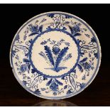 A Large 18th Century Blue & White Delft Dish decorated with flowers, 14" (35.5 cm) in diameter.