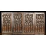 A Group of Four 16th Century Oak Panels carved with Gothic tracery and measuring 16" x 8¼" (41 cm x