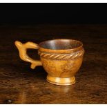 A Charming 19th Century Scandinavian Dug-out Birchwood Cup with silhouette cut handle.