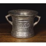 A Large 17th Century Cast Iron Mortar dated 1669 and initialed WG between raised ring moulding,