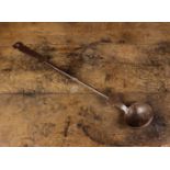 A 17th Century Iron Ladle 20¾" (53 cm) in length.