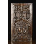 A 15th/Early 16th Century Oak Panel carved with a Gothic arch enriched with tracery and crested