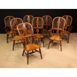 A Fine Matched Set of Eight High-backed Yew-wood Broad-arm Windsor Chairs.