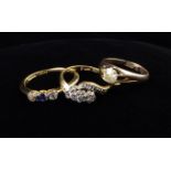 Three Vintage 18 Carat Gold & Diamond Rings: A diamond solitaire ring;